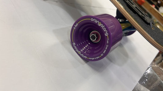 Purple Orangatang In Heat wheel close-up on High Five Miami complete