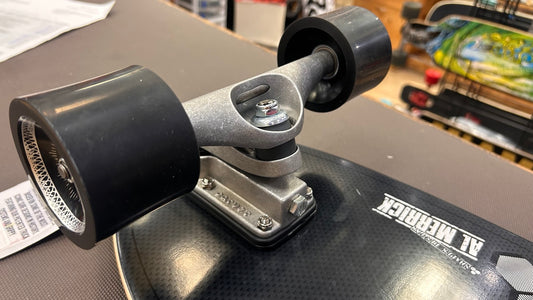Carver Black Tip Carbon Fiber 32.5 C7 truck and wheel close-up