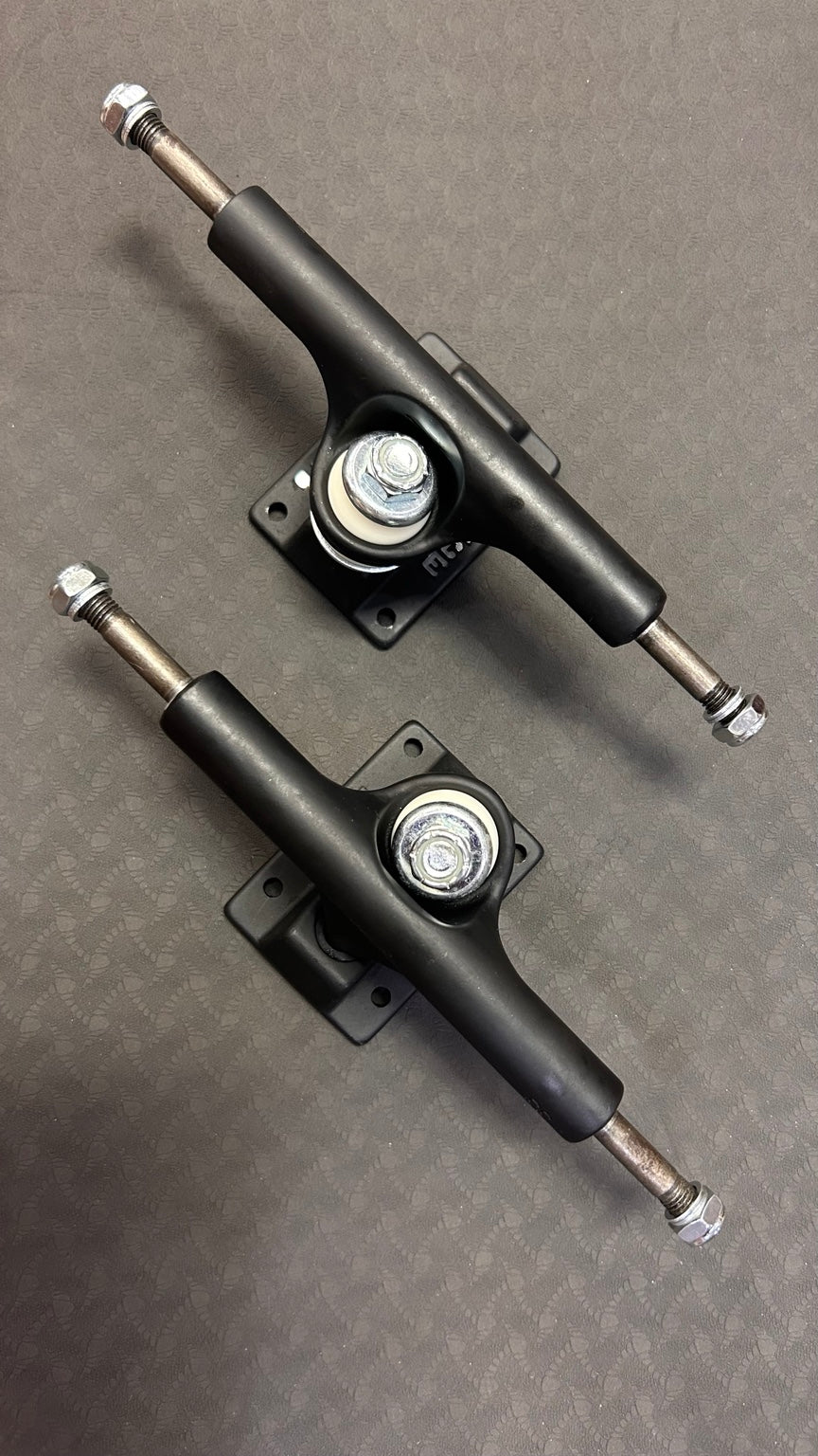Ace Classic 33 matte black skateboard trucks pair - angled view