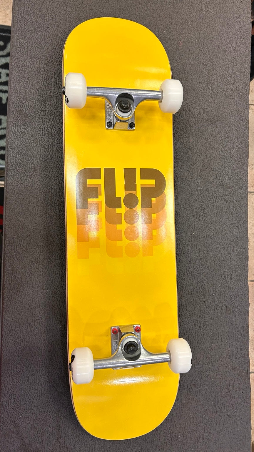 Flip complete skateboard yellow deck bottom