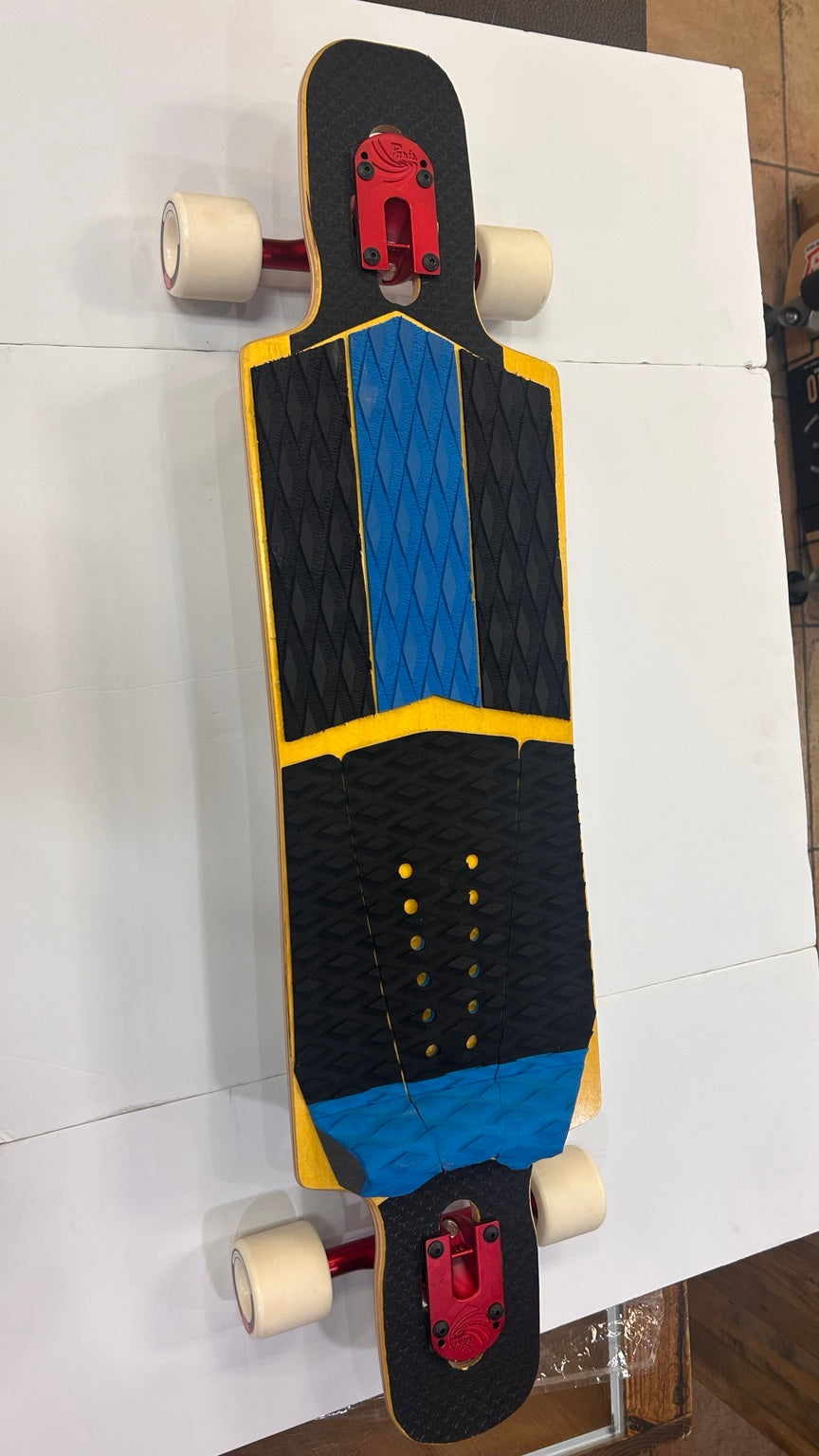 High Five complete longboard top view with handmade grip and red trucks